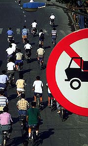cyclists-and-sign