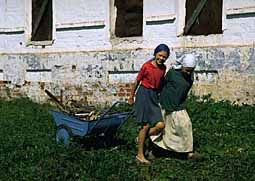 Girls pulling cart