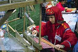 Folk dressed women with distaff