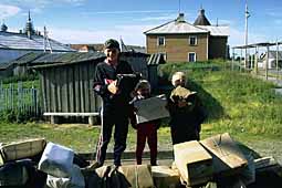 Children of a postman with parcels