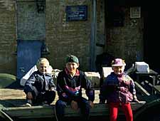 Children of a postman with parcels